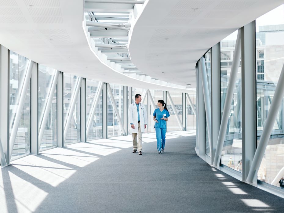 Shot of two healthcare workers walking together