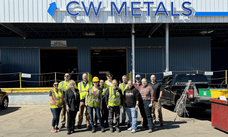 group standing in front of recycling company