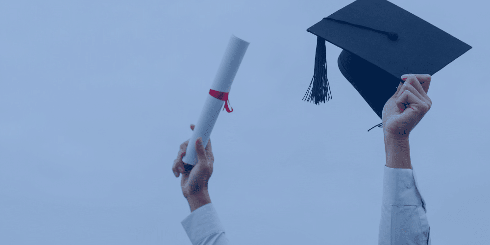 graduation cap and diploma are shown to depict graduation