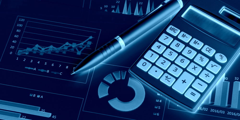 calculator and charts with an ink pen